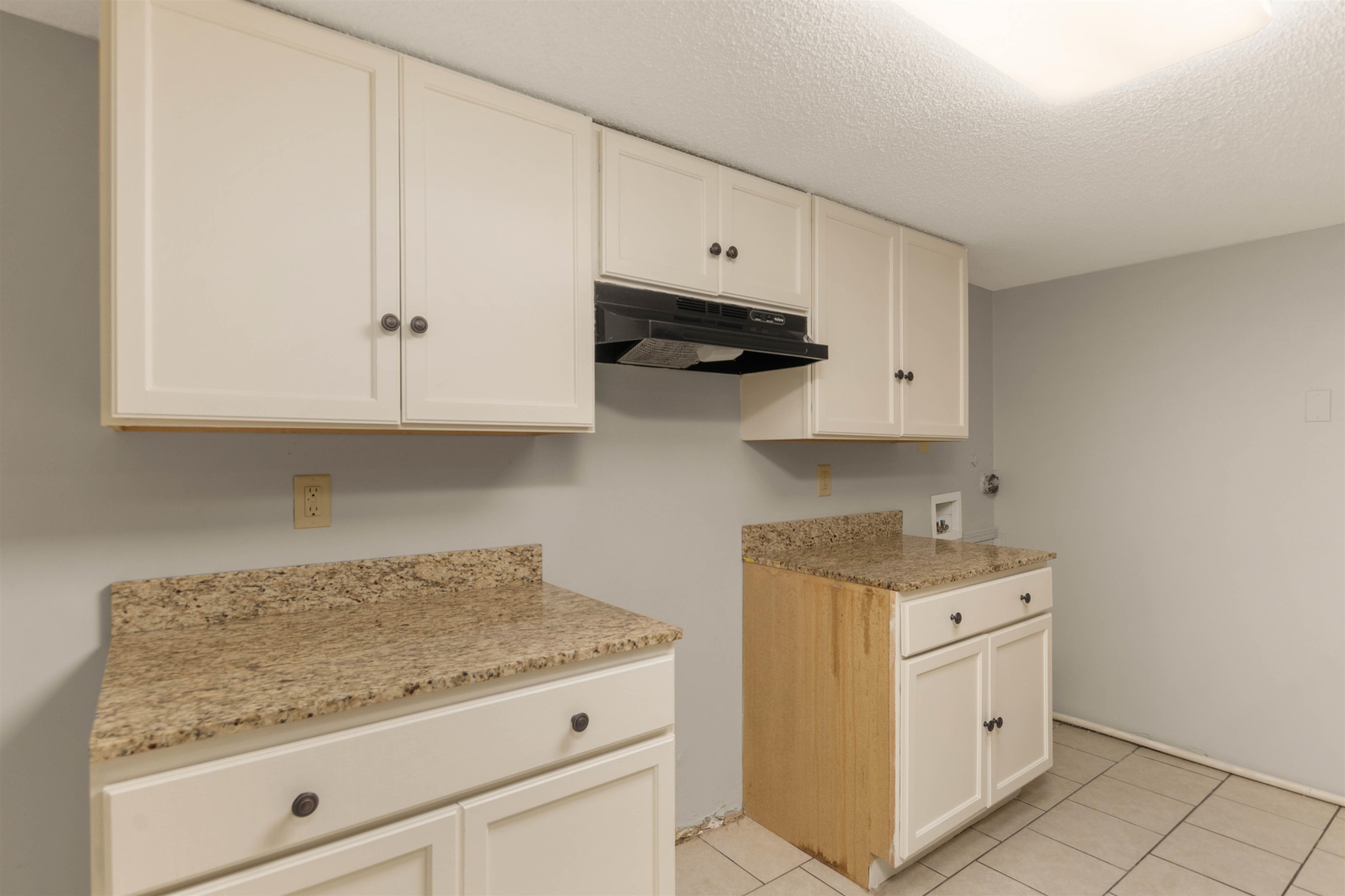 5573 Pleasant View Road, Unit 35 Memphis, TN 38134 - Photo 7 of 25 a kitchen with white cabinets and a stove with white cabinets