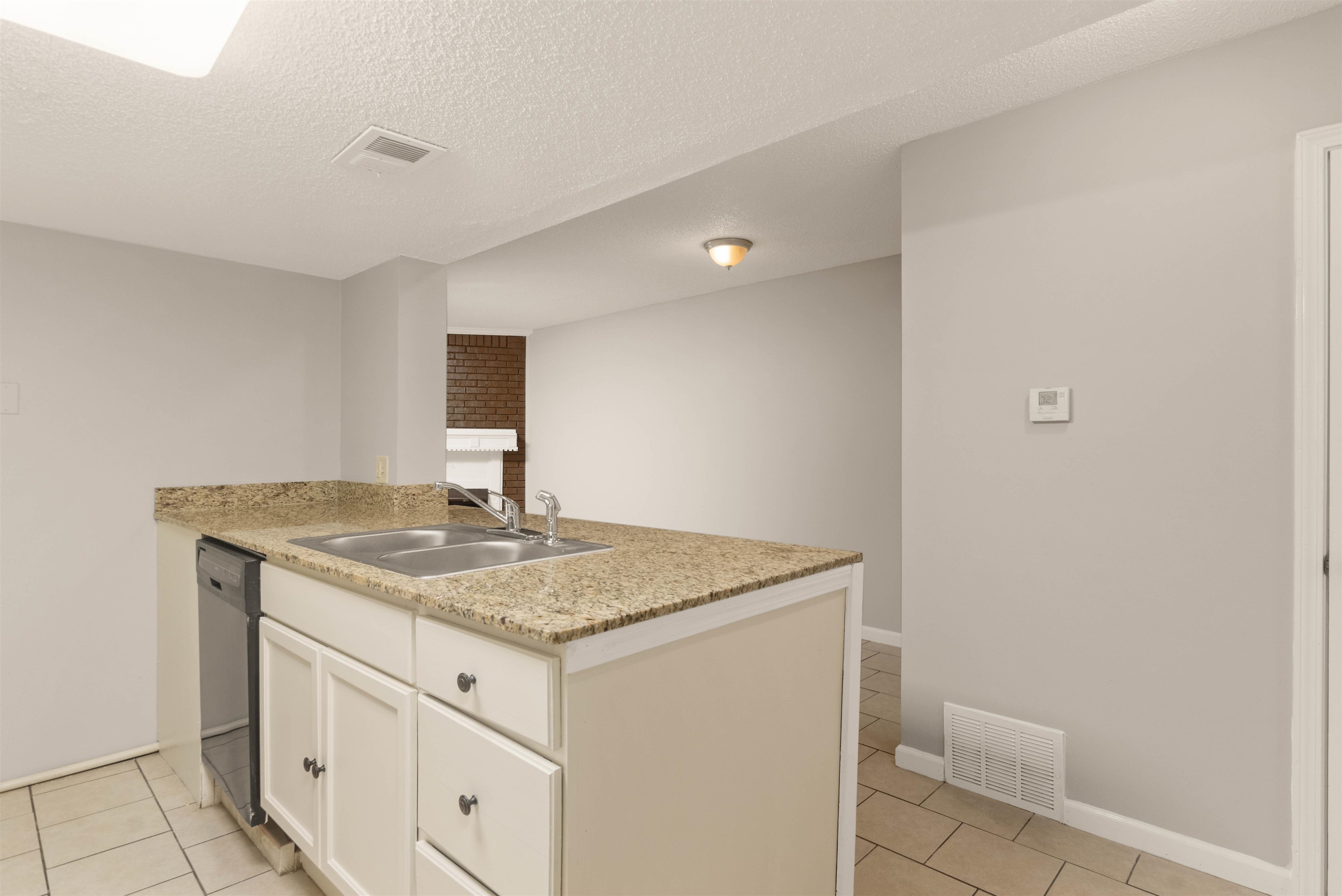 5573 Pleasant View Road, Unit 35 Memphis, TN 38134 - Photo 8 of 25 a bathroom with a granite countertop sink and a toilet