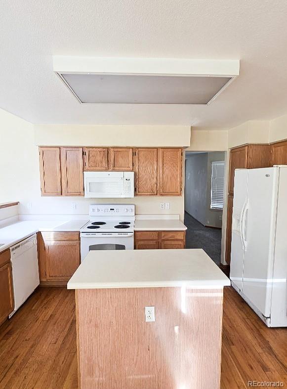 20420 Kelly Place Denver, CO 80249 - Photo 10 of 21 a kitchen with a stove a refrigerator and a sink
