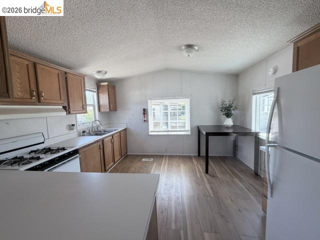 14192 Tuolumne Road, Unit 5 Sonora, CA 95370 - Photo 2 of 10 a kitchen with sink cabinets and wooden floor