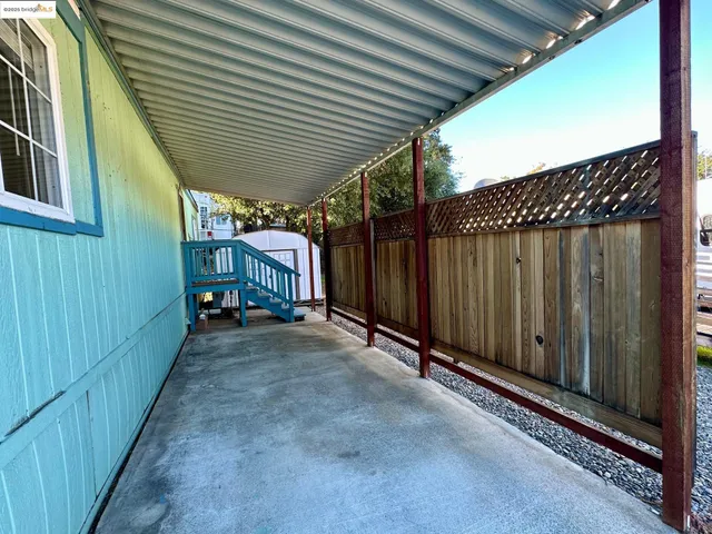 a view of a backyard with a fence