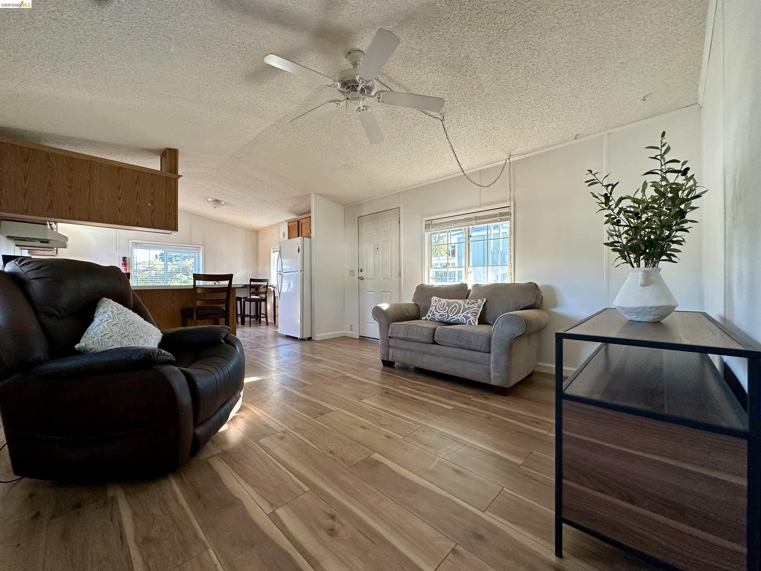 14192 Tuolumne Road, Unit 5 Sonora, CA 95370 - Photo 3 of 10 a living room with furniture and a chandelier