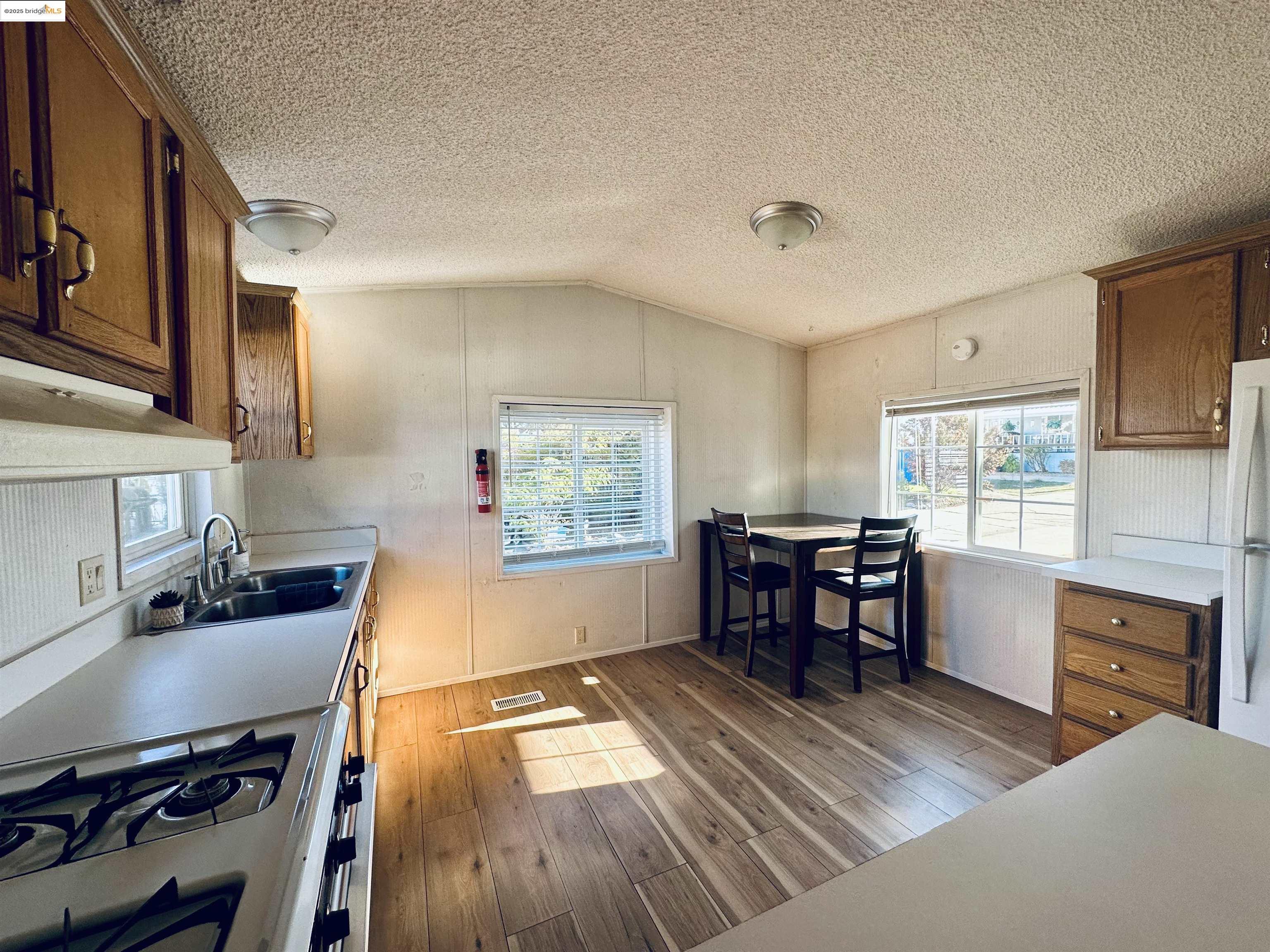 14192 Tuolumne Road, Unit 5 Sonora, CA 95370 - Photo 4 of 12 a workspace with furniture window and wooden floor