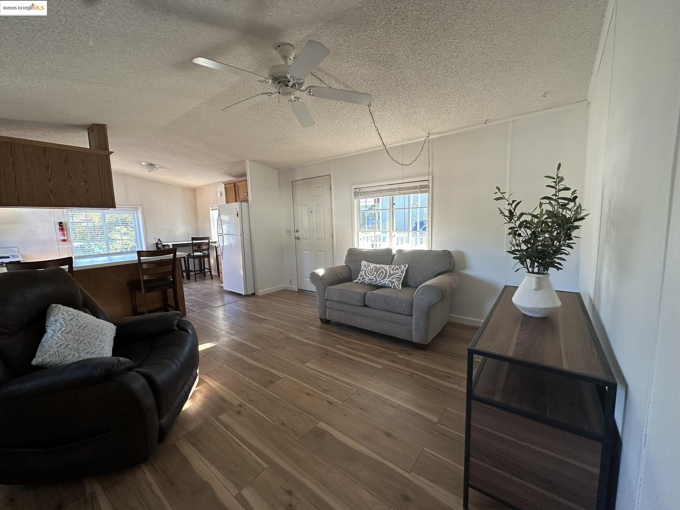 14192 Tuolumne Road, Unit 5 Sonora, CA 95370 - Photo 6 of 12 a living room with furniture and a potted plant