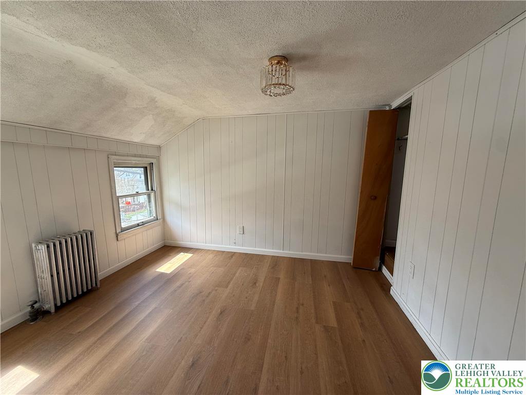619 Hickory Street Scranton, PA 18505 - Photo 14 of 28 a view of an empty room and a gallery with wooden floor
