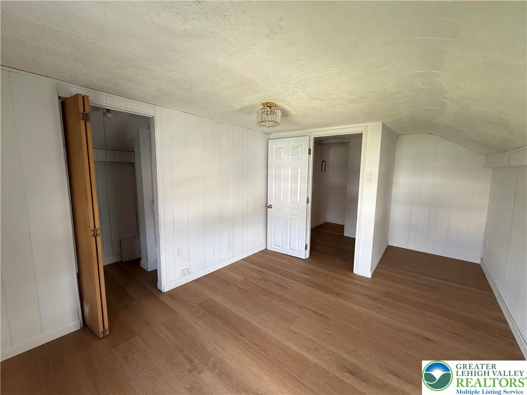 619 Hickory Street Scranton, PA 18505 - Photo 17 of 28 a view of an empty room with wooden floor and closet