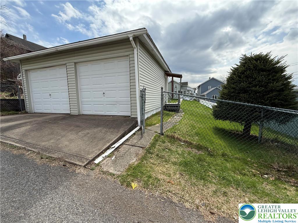 619 Hickory Street Scranton, PA 18505 - Photo 28 of 28 a backyard of a house with barbeque oven table and chairs