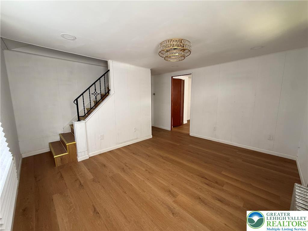619 Hickory Street Scranton, PA 18505 - Photo 3 of 28 a view of an empty room with wooden floor