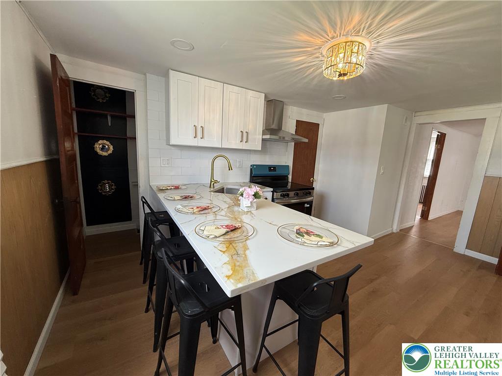 619 Hickory Street Scranton, PA 18505 - Photo 8 of 28 a view of a dining room with furniture and wooden floor