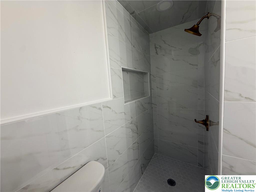 619 Hickory Street Scranton, PA 18505 - Photo 10 of 28 a bathroom with a shower and toilet