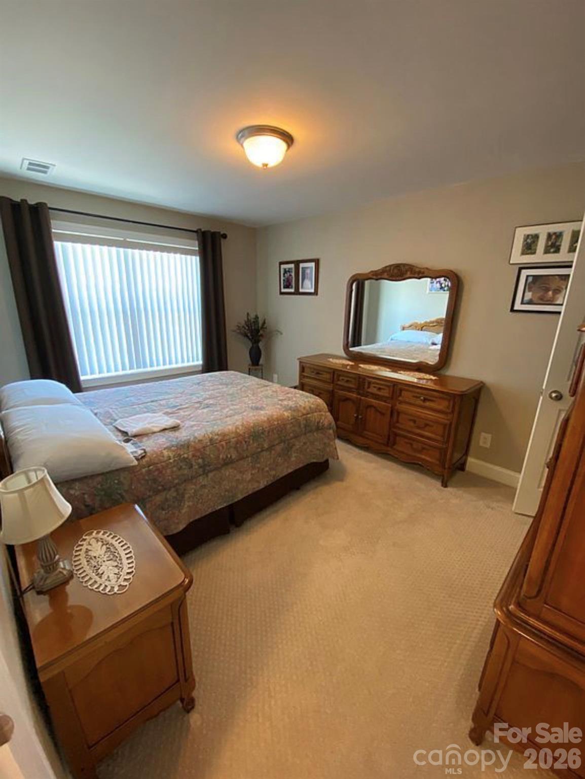 6042 Heavner Road Vale, NC 28168 - Photo 22 of 27 a bedroom with bed and window