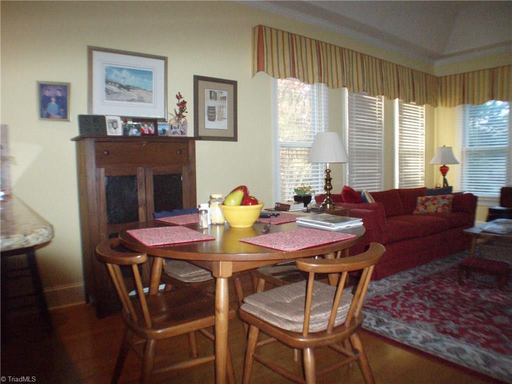 5802 Fleming Terrace Road Greensboro, NC 27410 - Photo 10 of 26 The breakfast area with access to kitchen and sun room.
