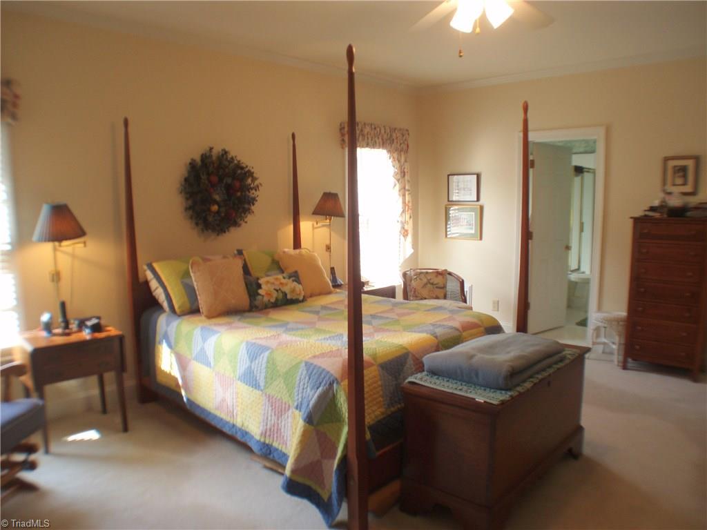 5802 Fleming Terrace Road Greensboro, NC 27410 - Photo 13 of 26 The generous master suite will easily accommodate a king-sized bed as well as other furnishings. Attached is a large walk in close.