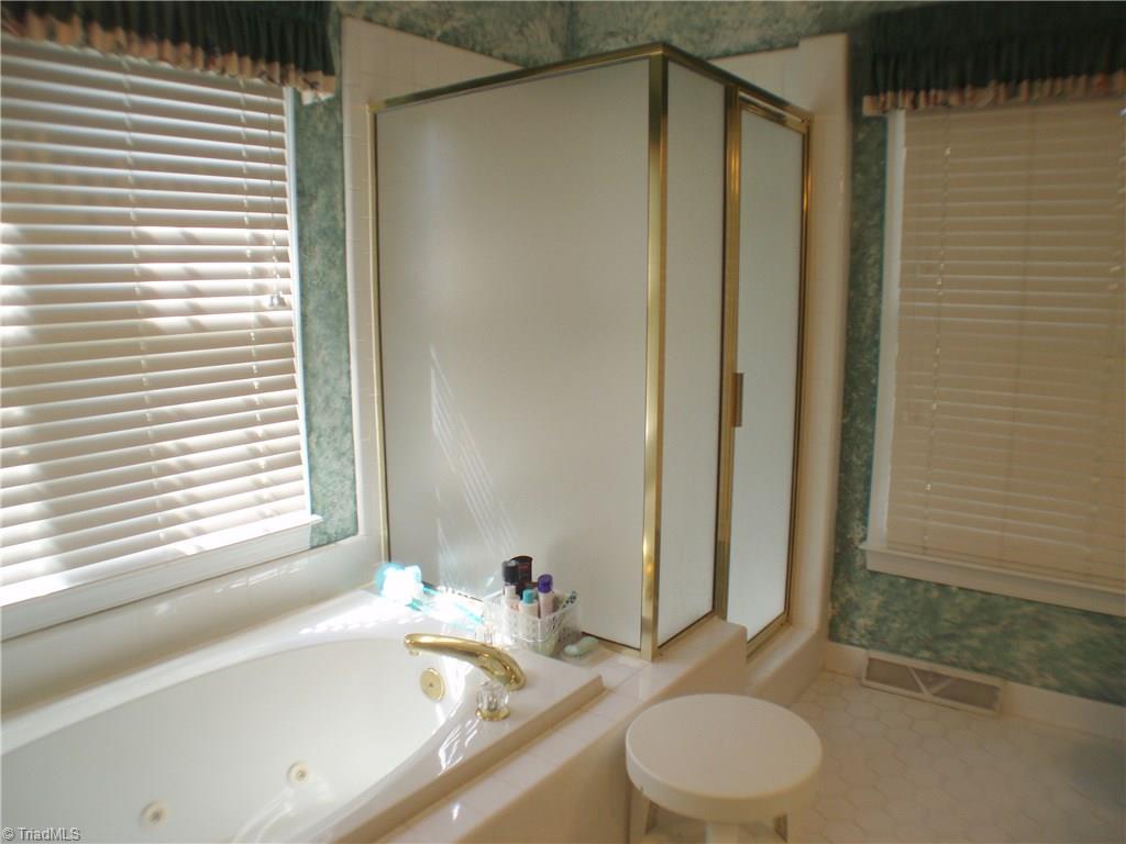 5802 Fleming Terrace Road Greensboro, NC 27410 - Photo 16 of 26 An ample shower is another feature in the master bath.
