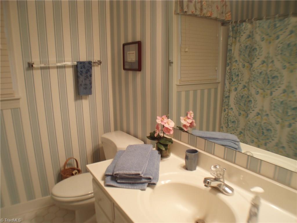 5802 Fleming Terrace Road Greensboro, NC 27410 - Photo 21 of 26 Bathroom #2 is located between Bedrooms 2 and 3 and also serves as a guest bath.