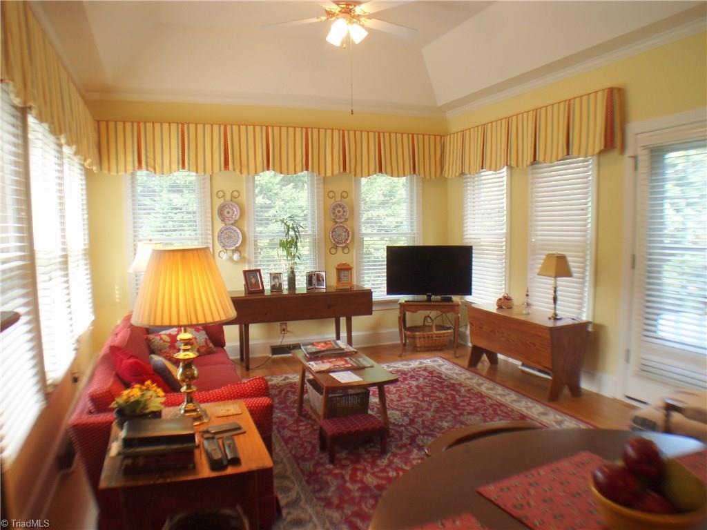 5802 Fleming Terrace Road Greensboro, NC 27410 - Photo 9 of 26 Offering connectivity from the breakfast area to the kitchen, the sun room has a great deal of flexibility in its use. Hardwoods in this room as well. There are 2" blinds on windows throughout the home.