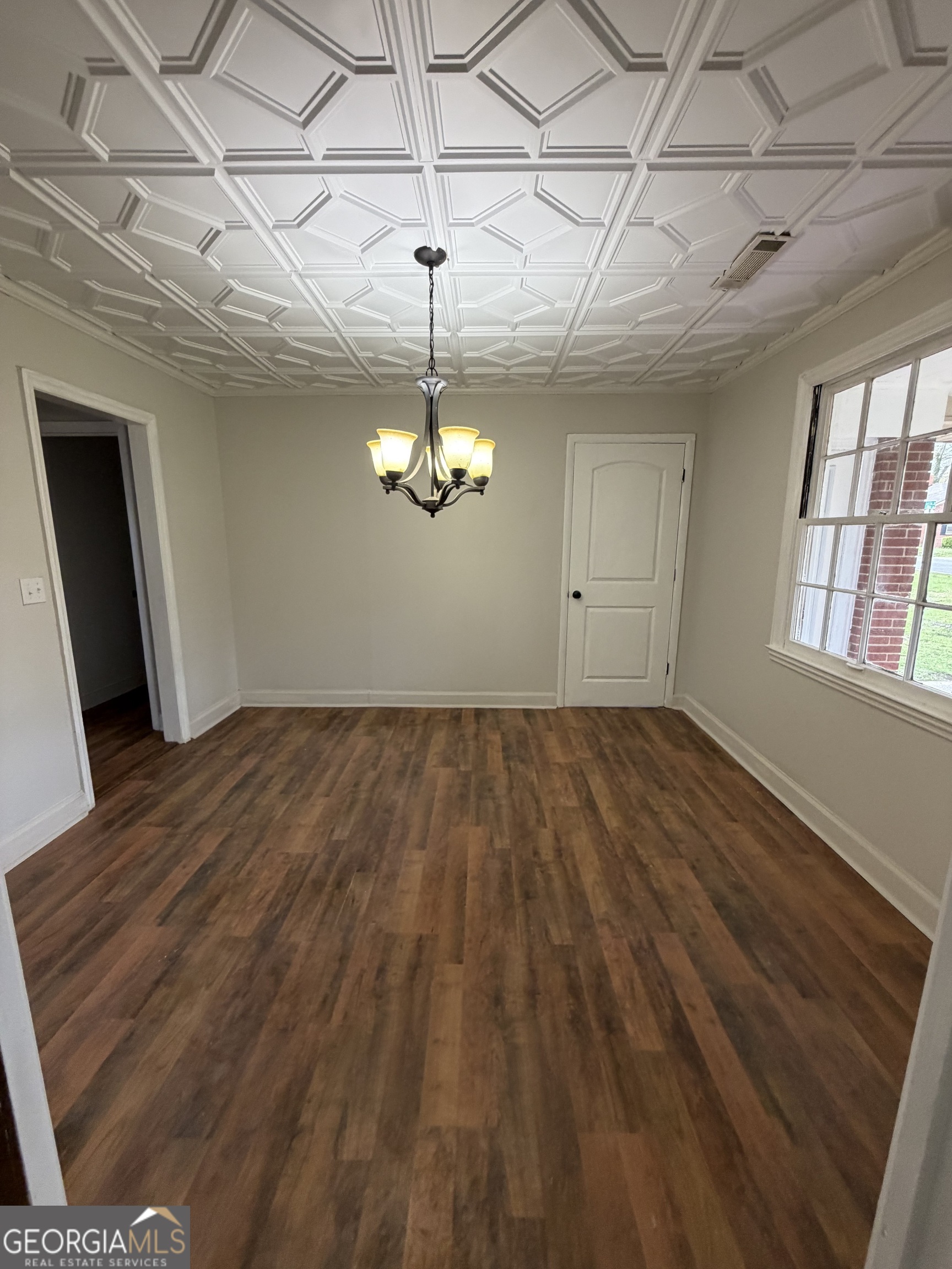 412 West 4th Street Vidalia, GA 30474 - Photo 23 of 23 a view of empty room with wooden floor