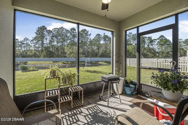 a balcony with furniture and garden view