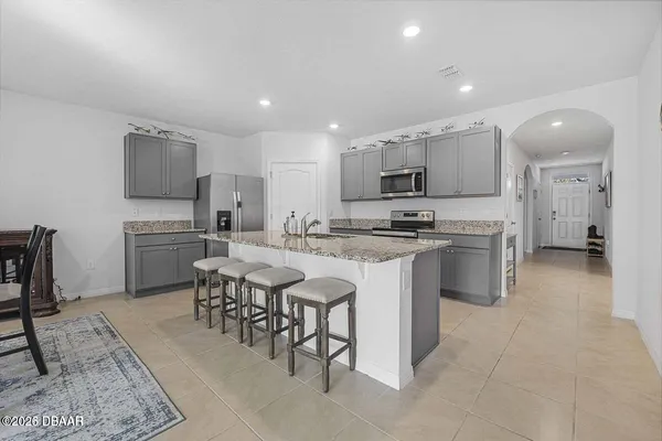 a kitchen with cabinets a sink and appliances