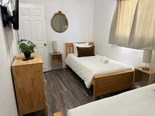 a bedroom with bed and window