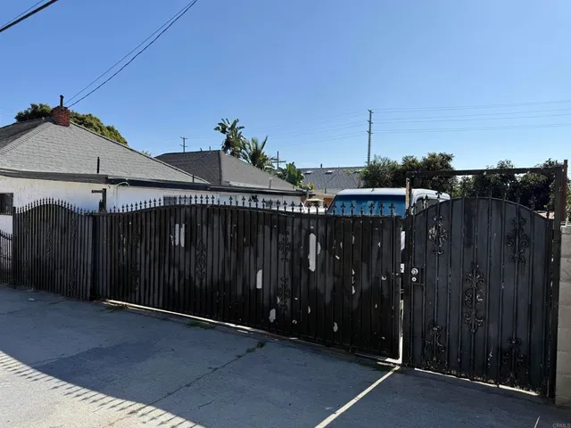 a roof deck with wooden fence