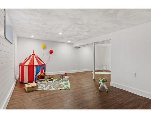 10 Yale Road Arlington, MA 02474 - Photo 19 of 23 a room with gym equipment and wooden floor