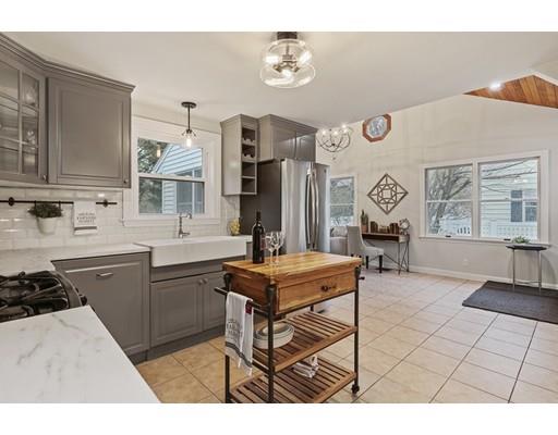 10 Yale Road Arlington, MA 02474 - Photo 6 of 23 a kitchen with stainless steel appliances granite countertop a stove a sink dishwasher and cabinets with wooden floor