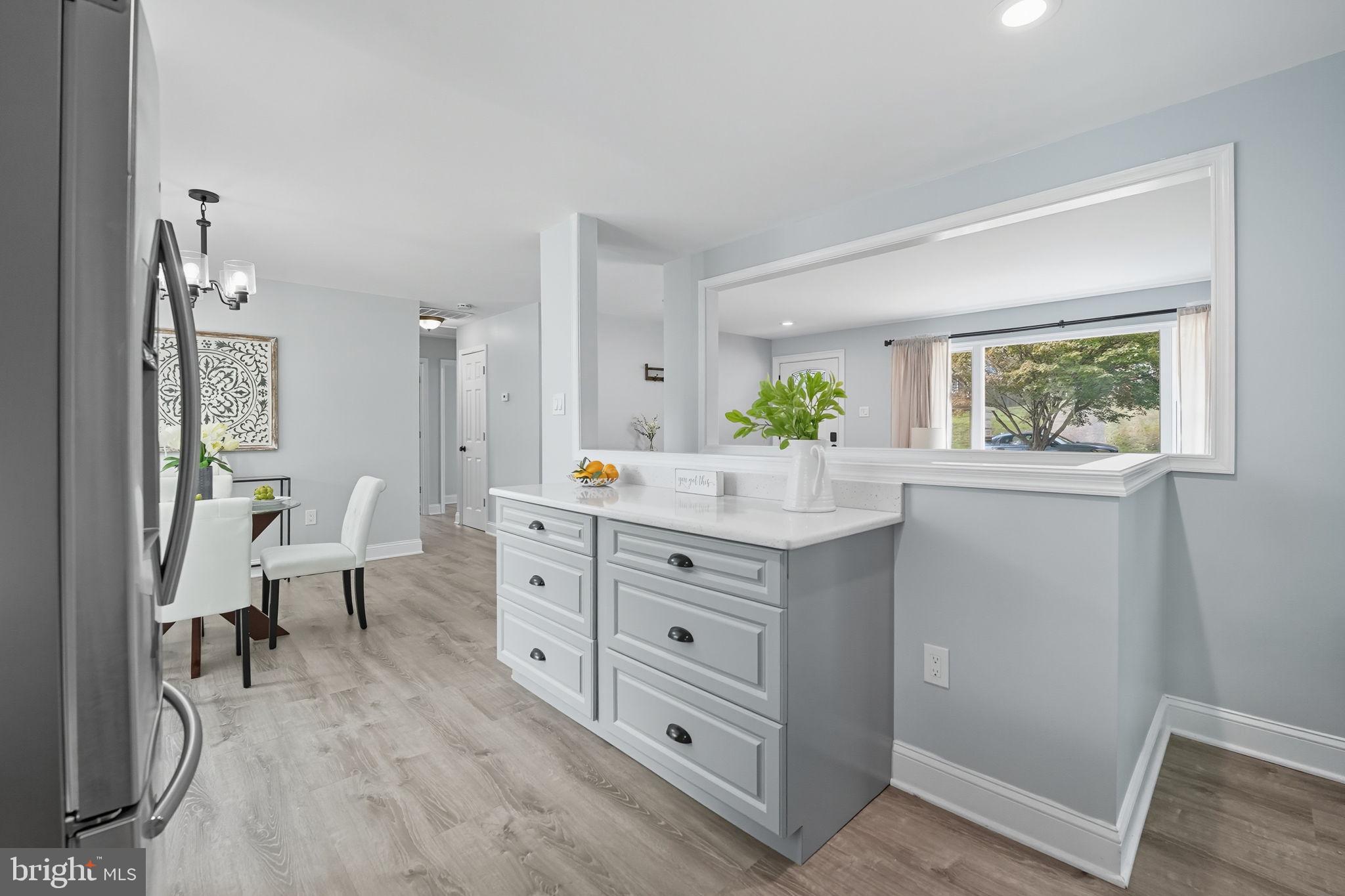 3708 Woodridge Avenue Silver Spring, MD 20902 - Photo 12 of 38 a spacious bathroom with a granite countertop sink a mirror and a bathtub