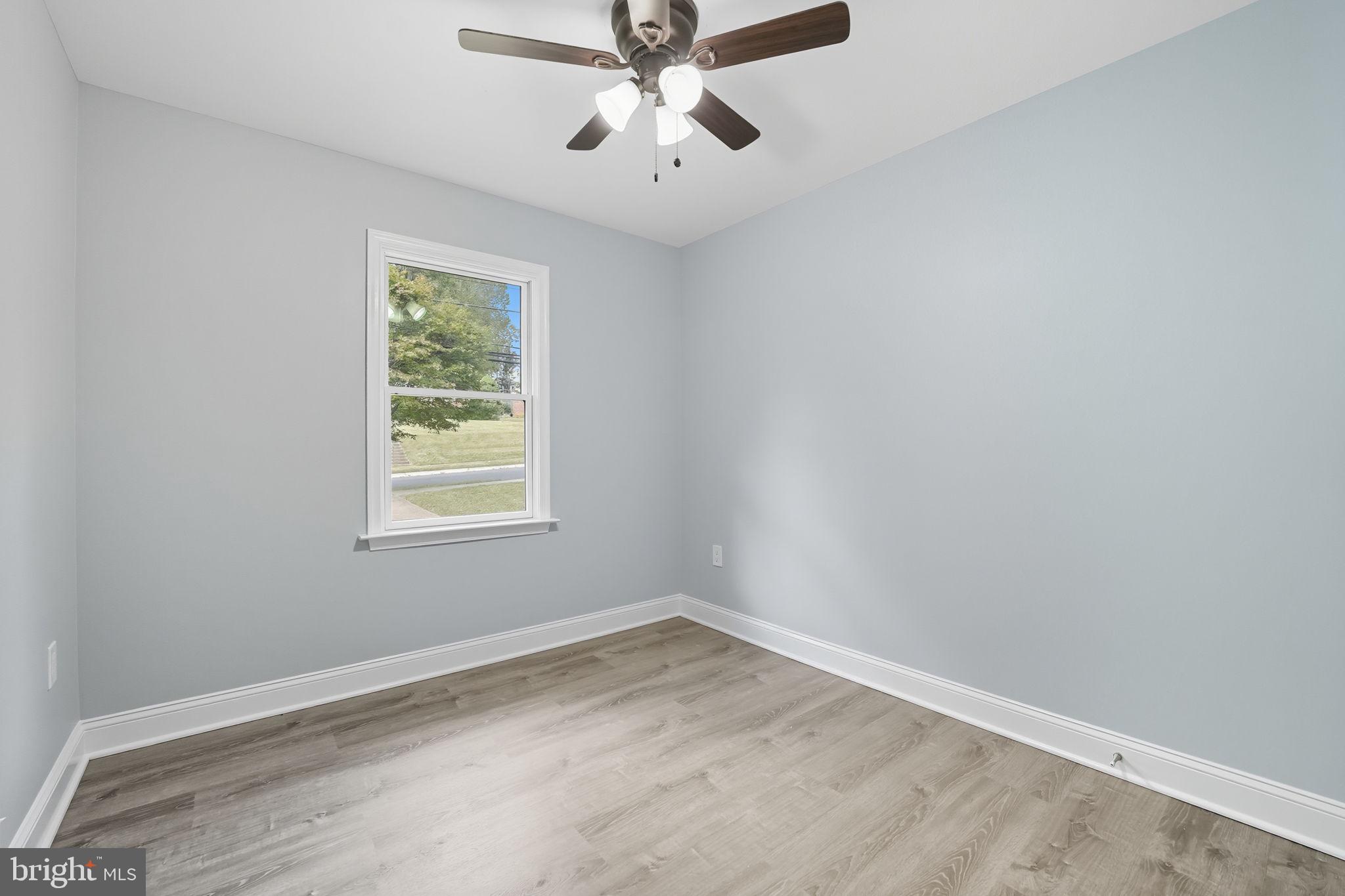 3708 Woodridge Avenue Silver Spring, MD 20902 - Photo 16 of 38 an empty room with a window and a fan