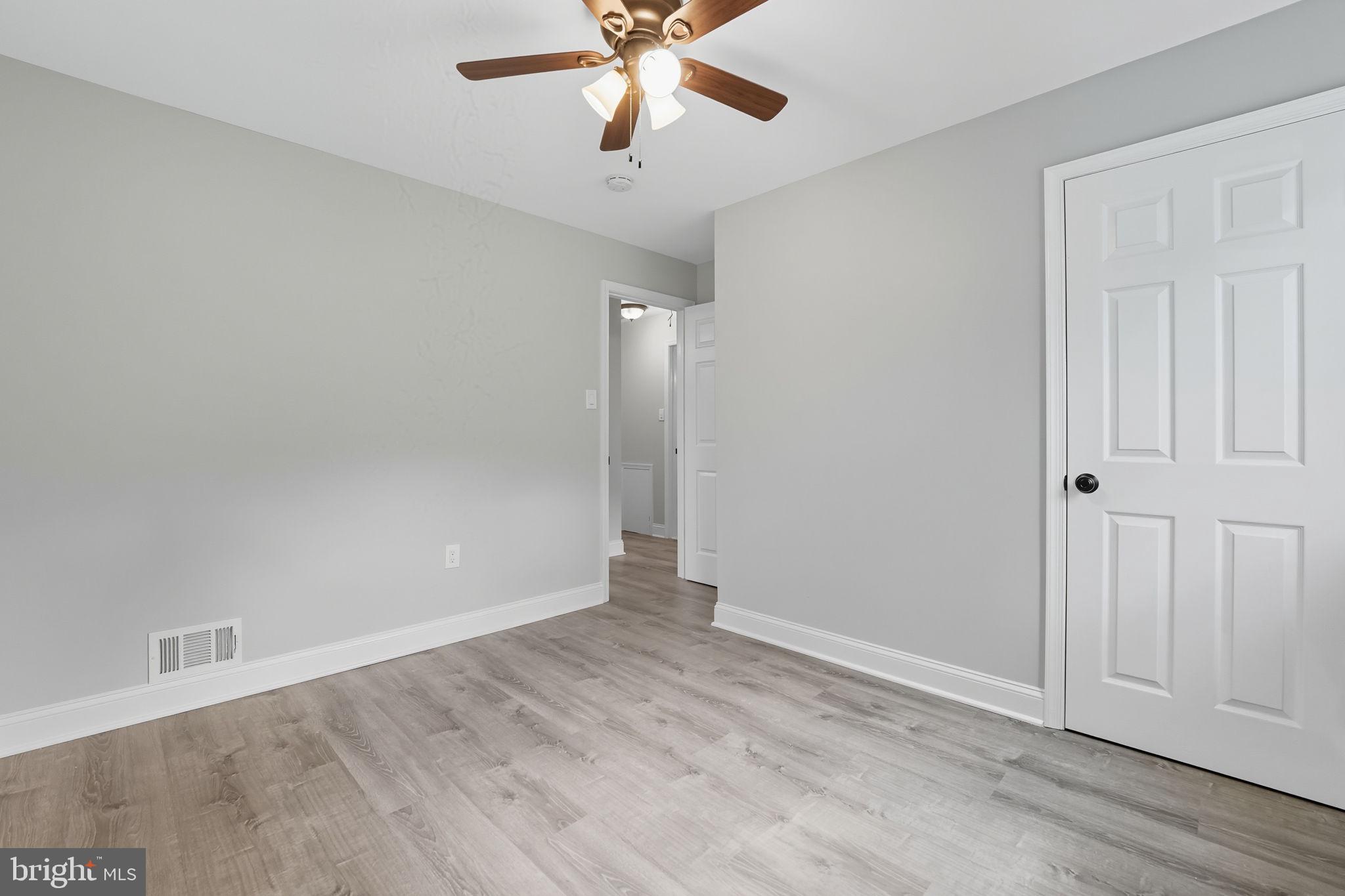 3708 Woodridge Avenue Silver Spring, MD 20902 - Photo 19 of 38 wooden floor in an empty room with a window