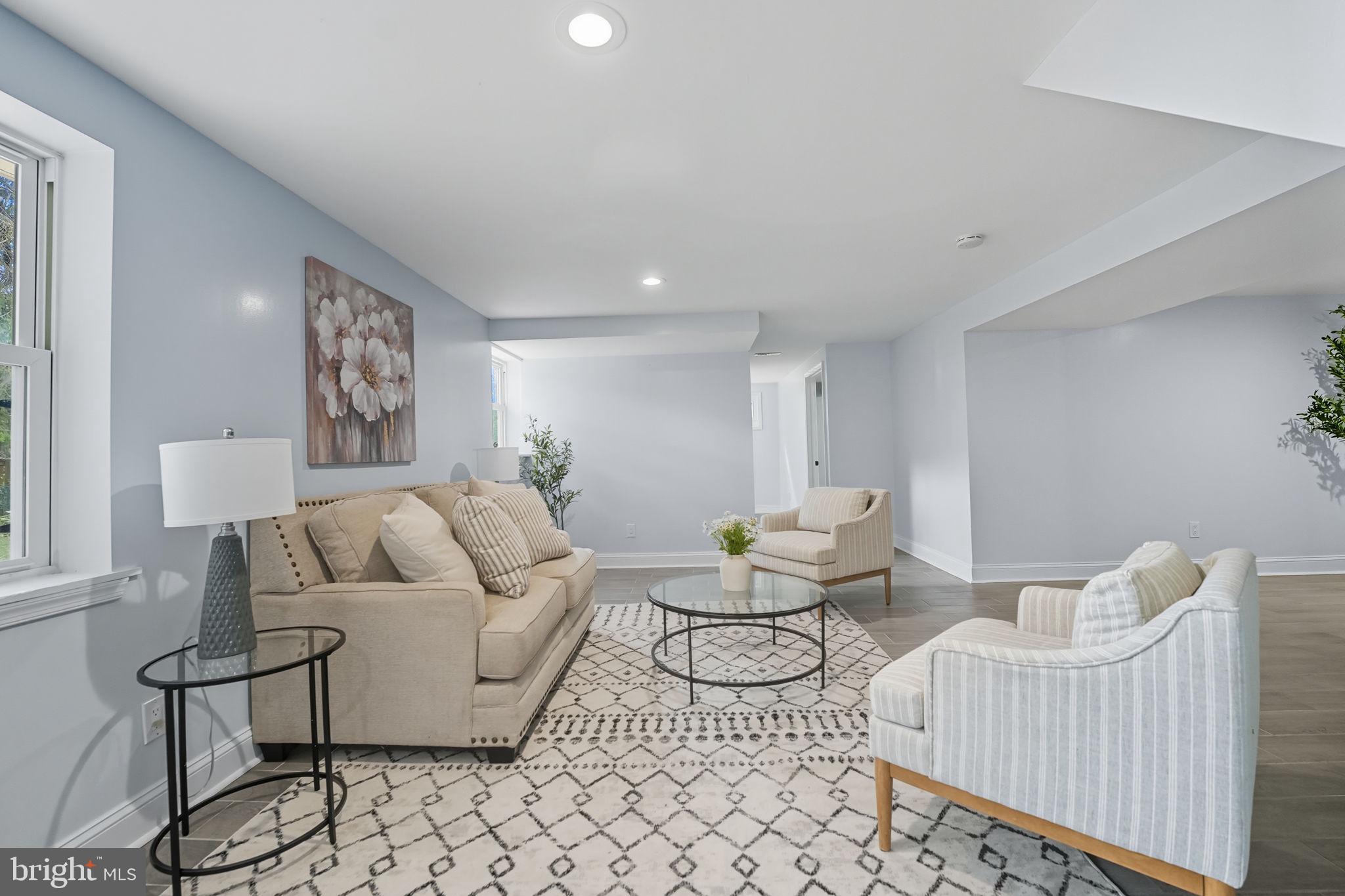 3708 Woodridge Avenue Silver Spring, MD 20902 - Photo 22 of 38 a living room with furniture and a table