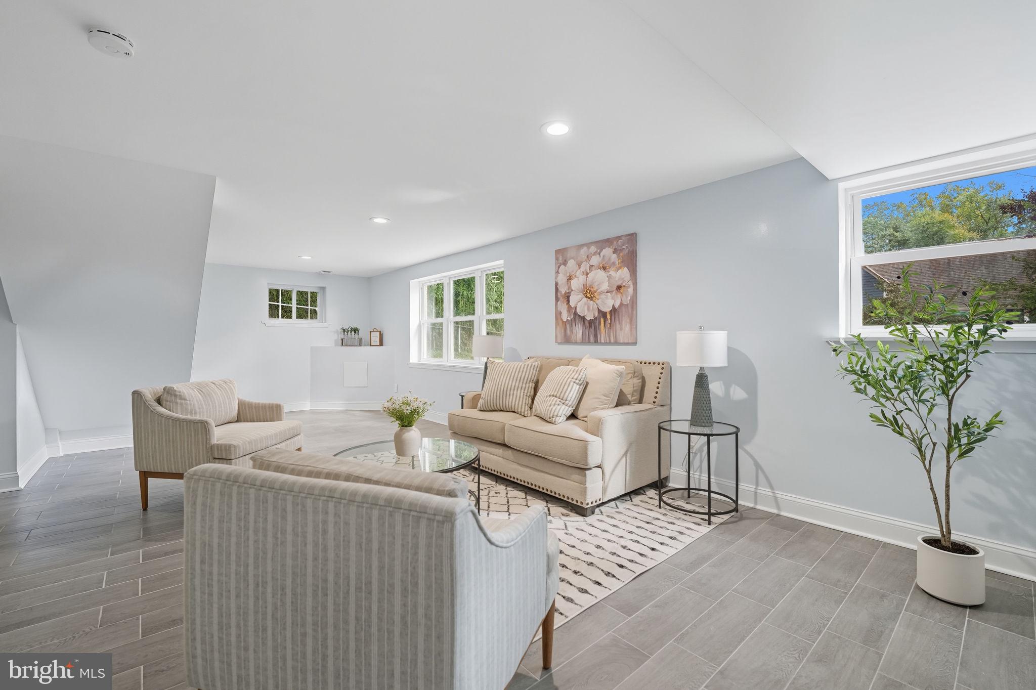 3708 Woodridge Avenue Silver Spring, MD 20902 - Photo 23 of 38 a living room with furniture and a potted plant