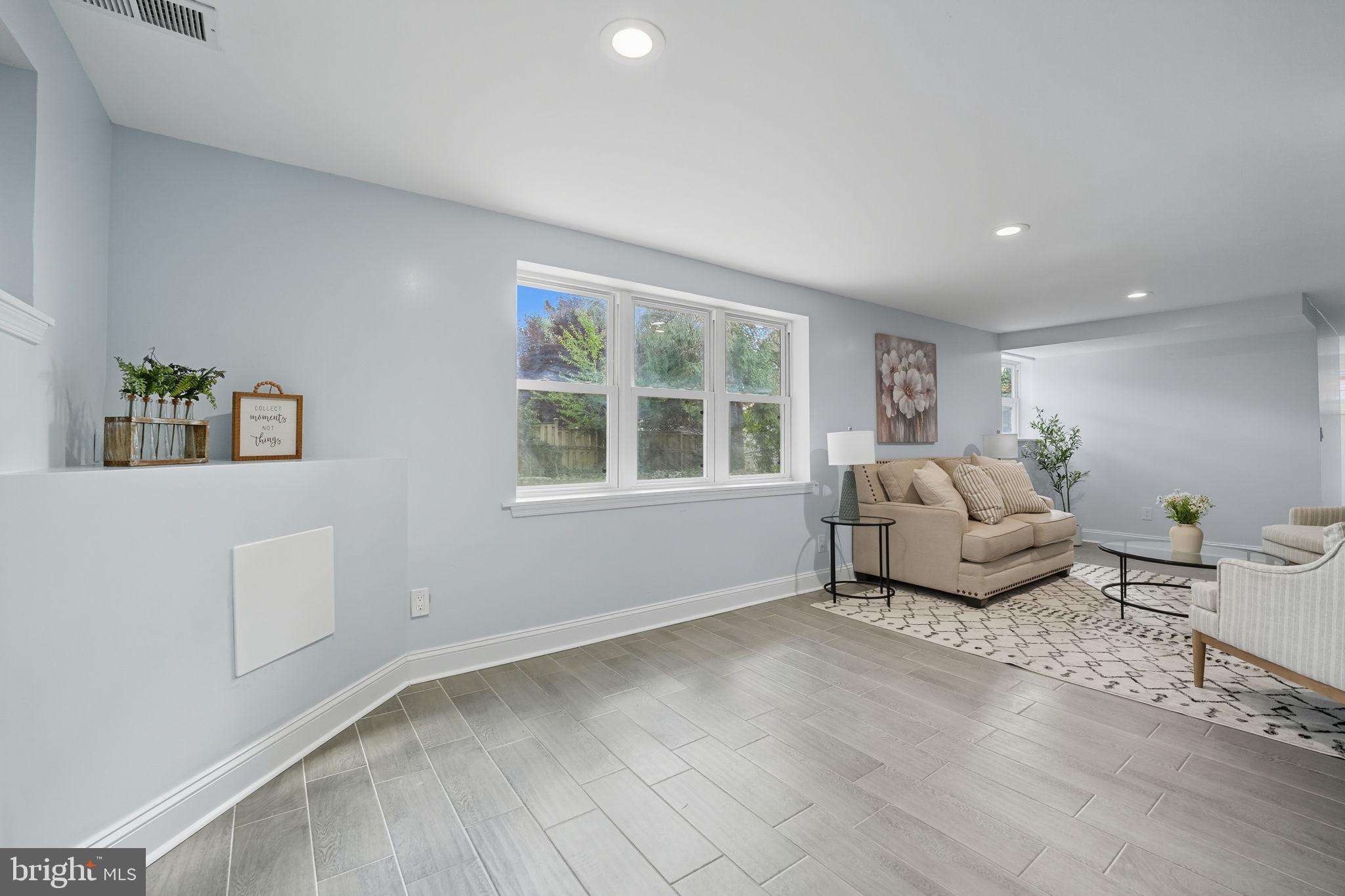 3708 Woodridge Avenue Silver Spring, MD 20902 - Photo 25 of 38 a living room with furniture and windows