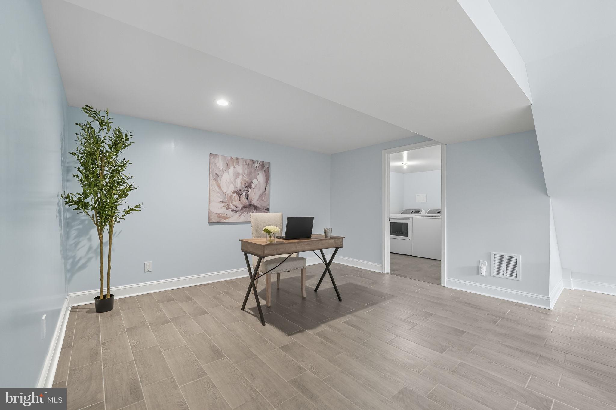 3708 Woodridge Avenue Silver Spring, MD 20902 - Photo 26 of 38 a view of a work space with furniture and wooden floor