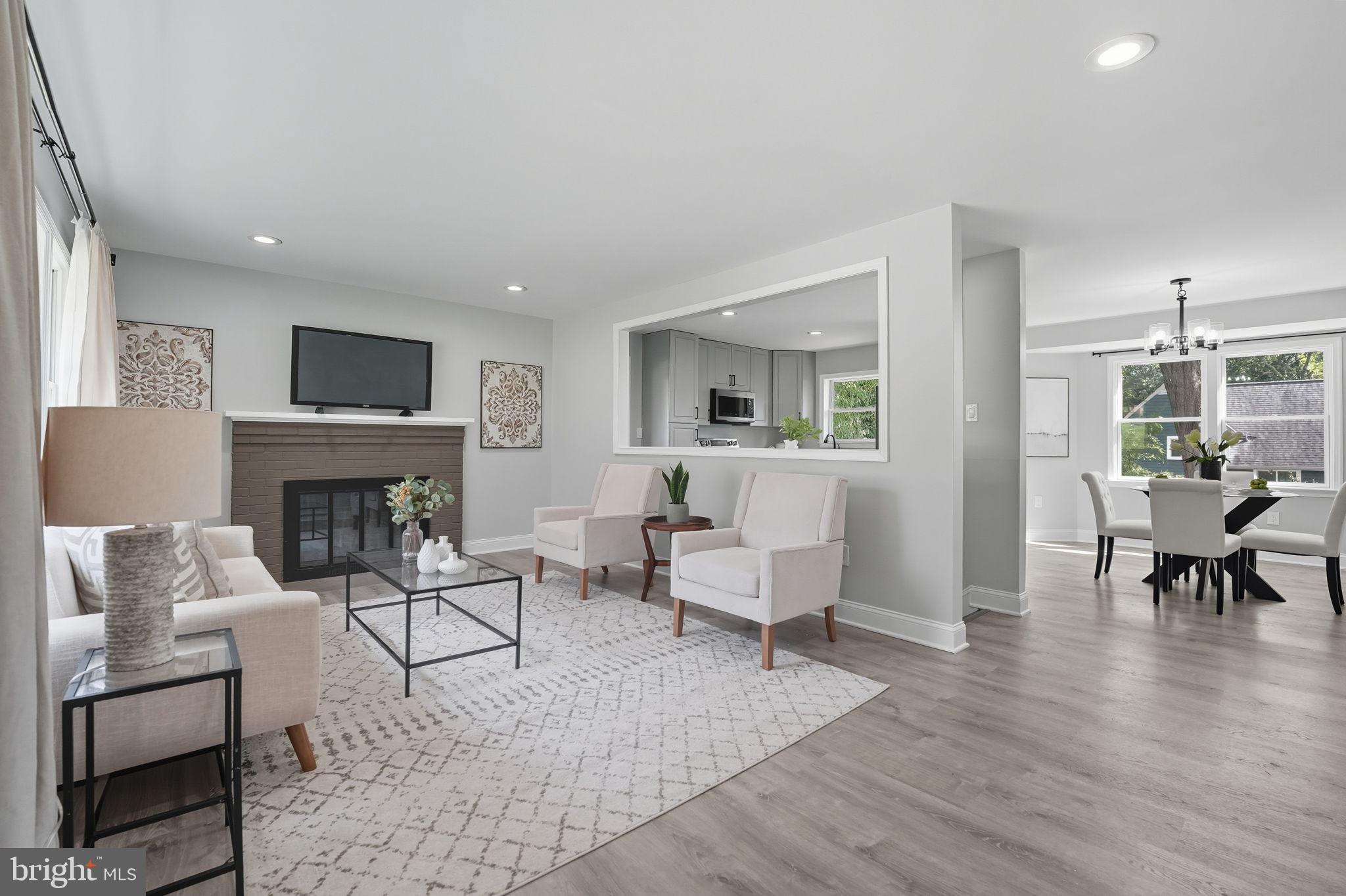 3708 Woodridge Avenue Silver Spring, MD 20902 - Photo 3 of 38 a living room with furniture and a fireplace