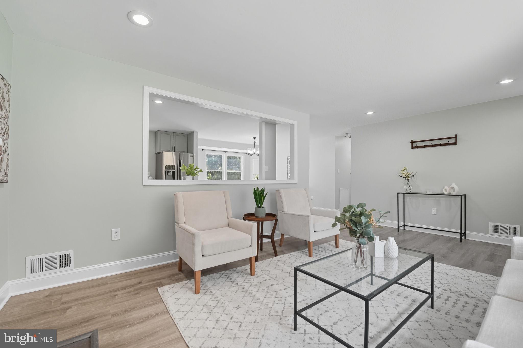 3708 Woodridge Avenue Silver Spring, MD 20902 - Photo 4 of 38 a living room with furniture and a potted plant