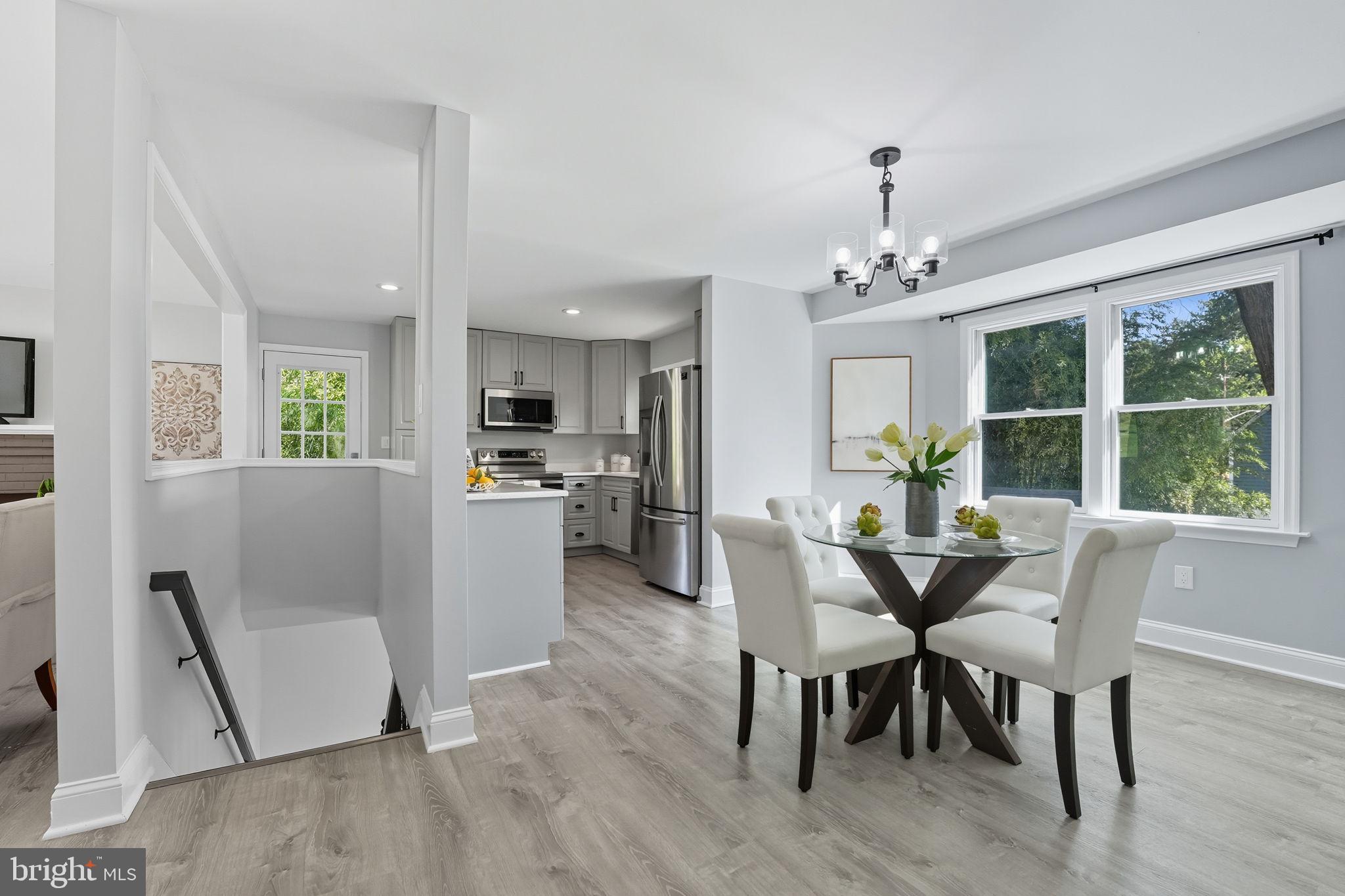 3708 Woodridge Avenue Silver Spring, MD 20902 - Photo 6 of 38 a view of a dining room with furniture and wooden floor