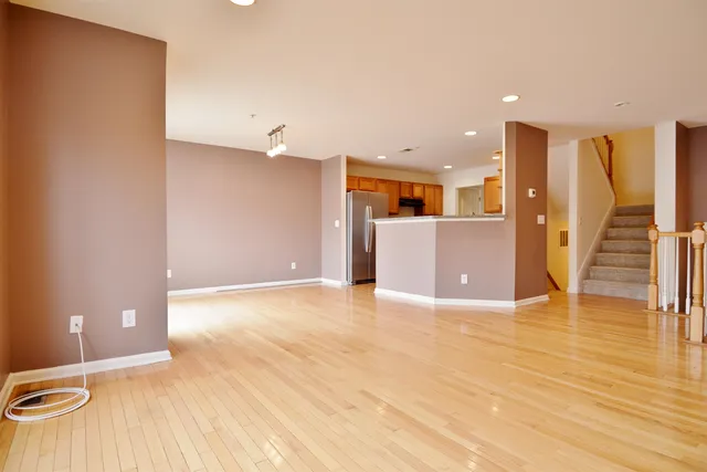a view of a livingroom with wooden floor