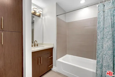 a bathroom with a bathtub and a sink