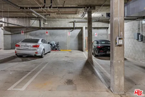 a view of parking garage with cars