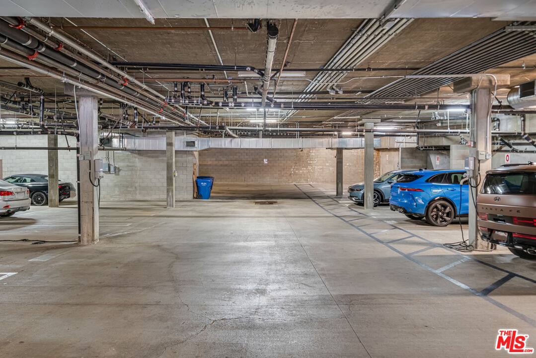 1248 North Laurel Avenue, Unit 103 West Hollywood, CA 90046 - Photo 24 of 25 a view of parking garage with cars