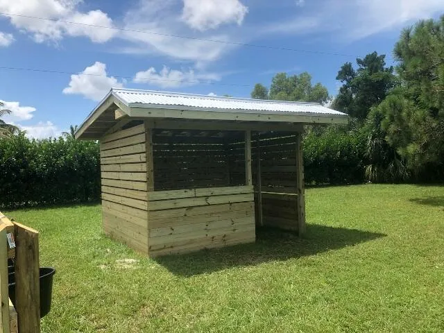 a view of a field with grass and a big yard