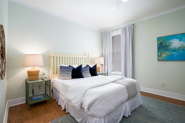 a bedroom with bed and a night stand