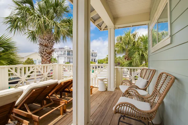 a view of a balcony with furniture