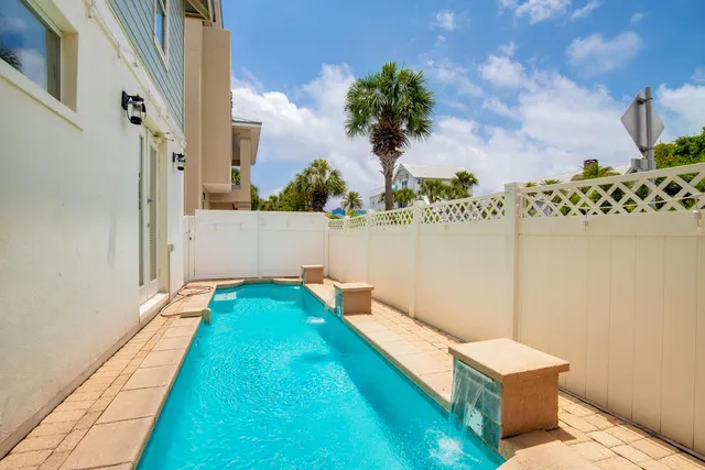 a view of living room with furniture and a potted plant