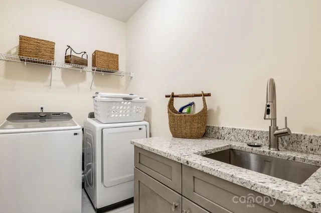 a view living room with washer and dryer