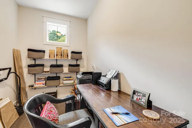 a living room with furniture and next to a window
