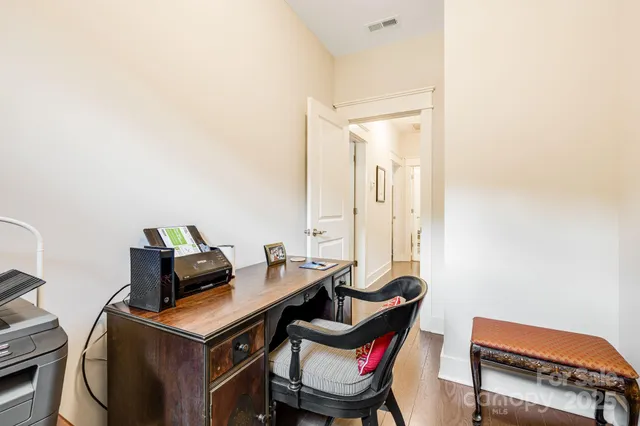 a view of a workspace with furniture