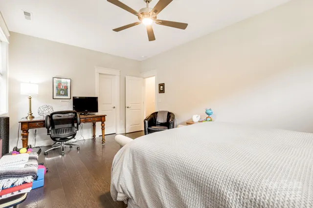 a bedroom with a bed gym equipment and a window