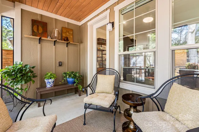 a living room with furniture and windows